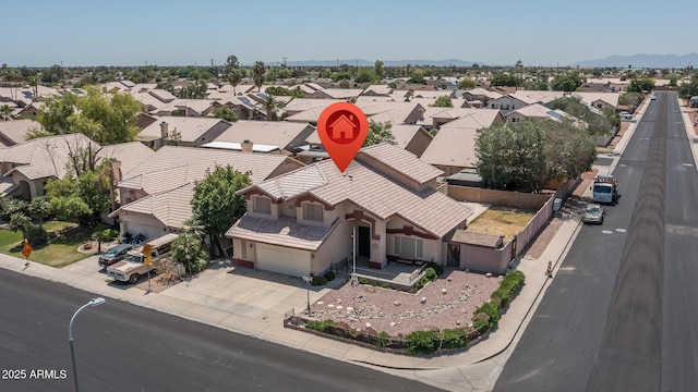 birds eye view of property with a residential view