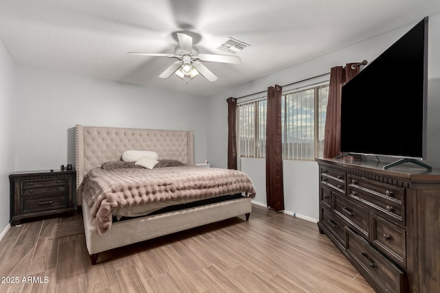 bedroom with ceiling fan and light hardwood / wood-style floors