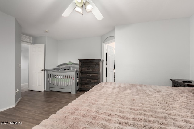 bedroom featuring ceiling fan and dark hardwood / wood-style flooring