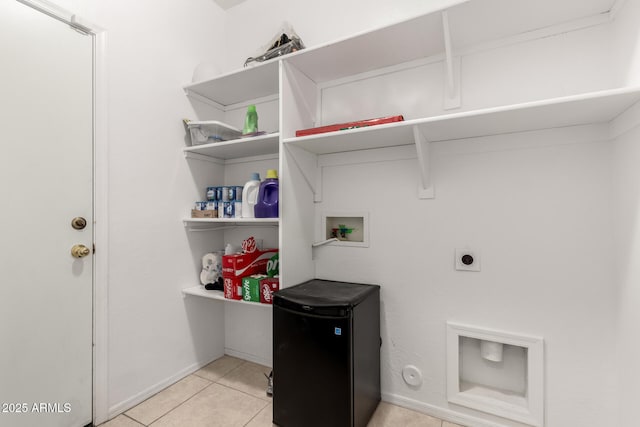 laundry room with light tile patterned floors, hookup for an electric dryer, and hookup for a washing machine