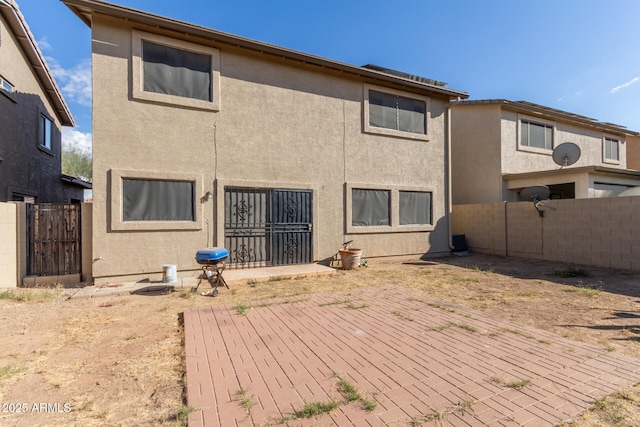 back of property featuring a patio