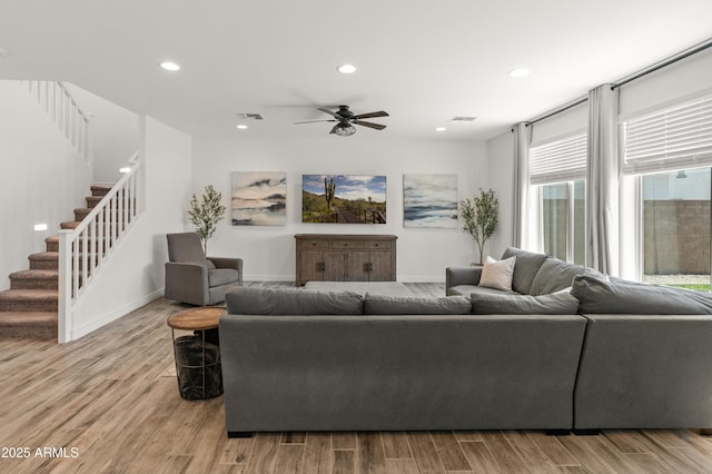 14435 W El Cortez Pl, Surprise, AZ 85387 - living room featuring ceiling fan, stairs, recessed lighting, wood finished floors, and baseboards