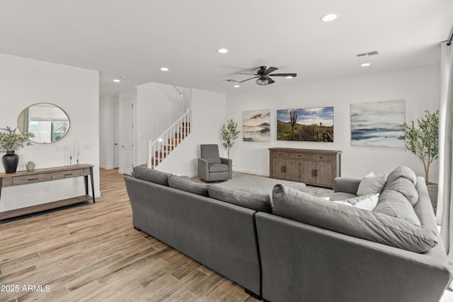 14435 W El Cortez Pl, Surprise, AZ 85387 - living area featuring recessed lighting, stairway, light wood-style floors, a ceiling fan, and baseboards