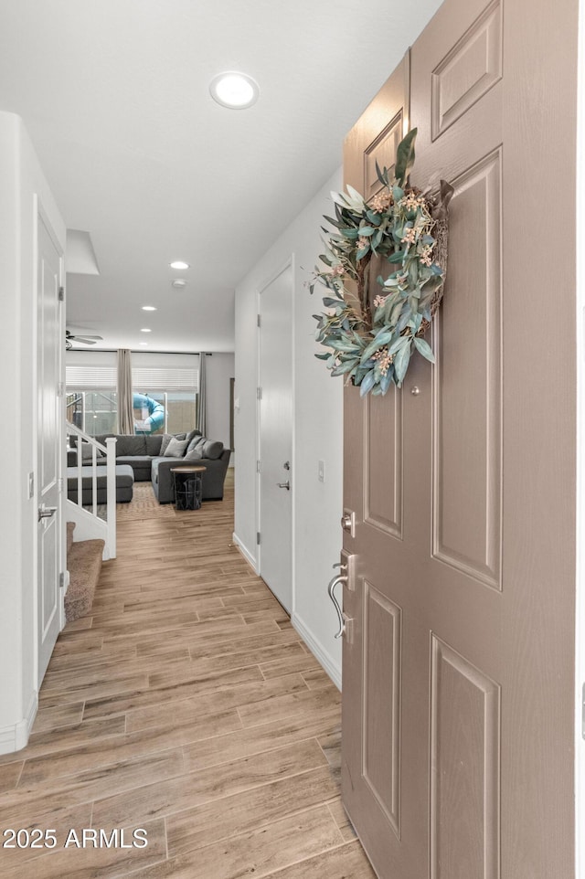 14435 W El Cortez Pl, Surprise, AZ 85387 - entrance foyer with light wood-style flooring, recessed lighting, baseboards, and stairway