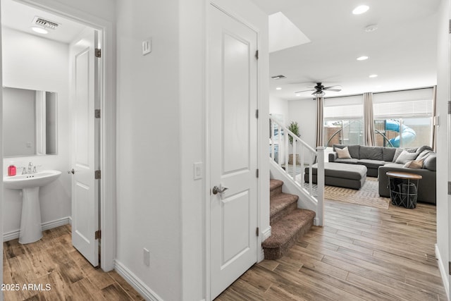 14435 W El Cortez Pl, Surprise, AZ 85387 - stairway featuring a ceiling fan, wood finished floors, recessed lighting, and baseboards