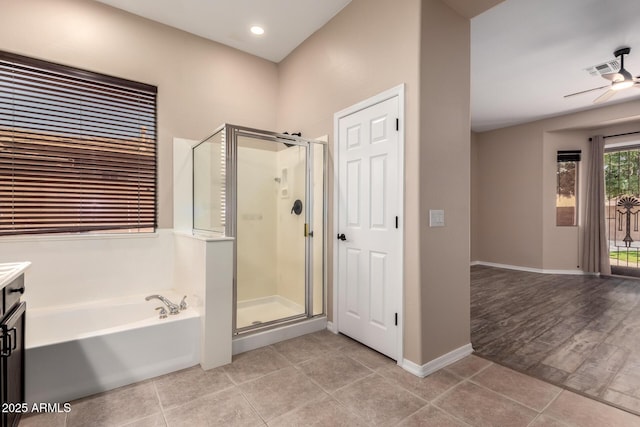 bathroom with ceiling fan, a shower stall, a bath, and tile patterned flooring