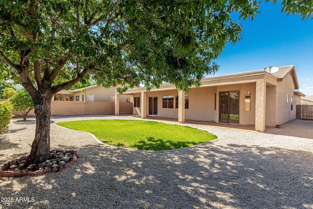 16837 W Northampton Rd, Surprise, AZ 85374 - back of house featuring stucco siding, a fenced backyard, and a patio area