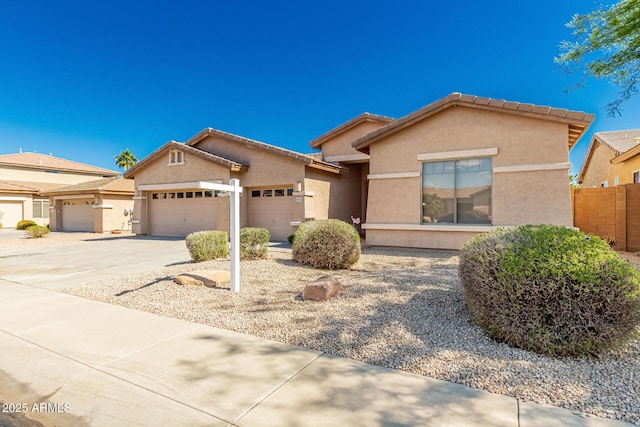 16837 W Northampton Rd, Surprise, AZ 85374 - view of front of property featuring a garage, driveway, stucco siding, and a tile roof