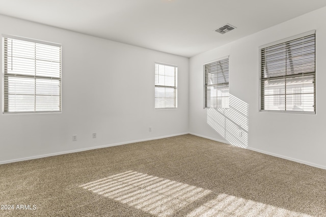 empty room featuring carpet flooring