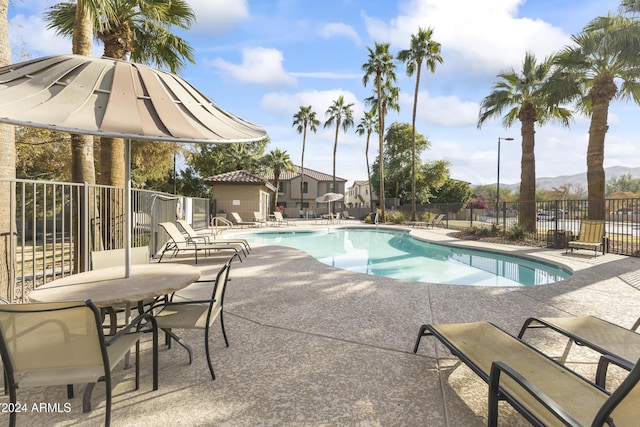 view of swimming pool with a patio area