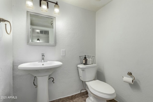 bathroom featuring toilet