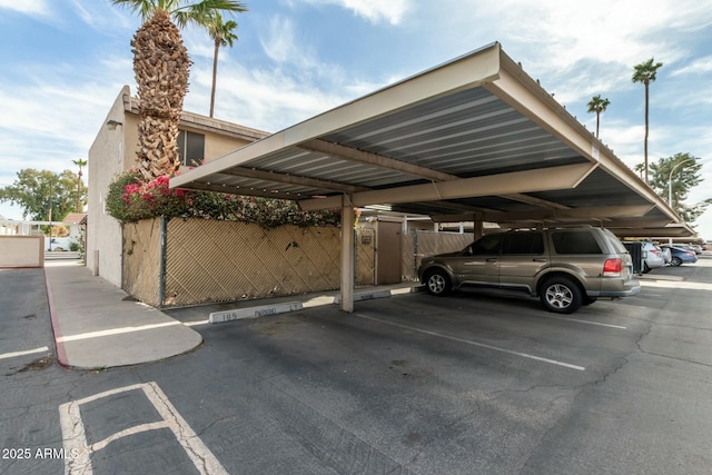 view of parking / parking lot featuring a carport