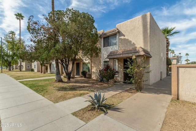 view of front of home with a front yard