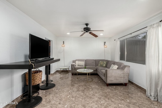 living room featuring crown molding and ceiling fan