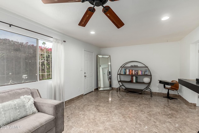 sitting room featuring ceiling fan