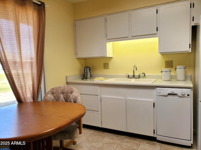 kitchen featuring white cabinetry, sink, light tile patterned floors, and dishwasher