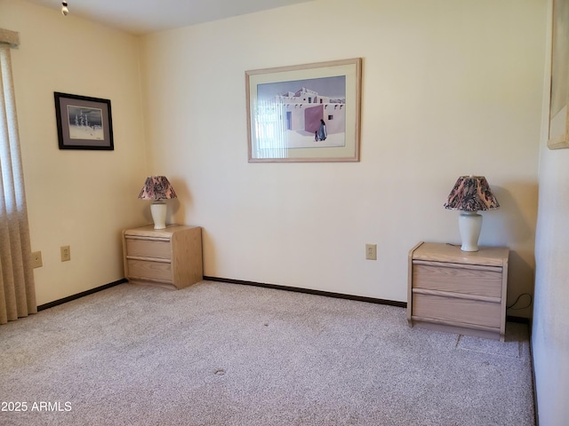 unfurnished bedroom with light colored carpet