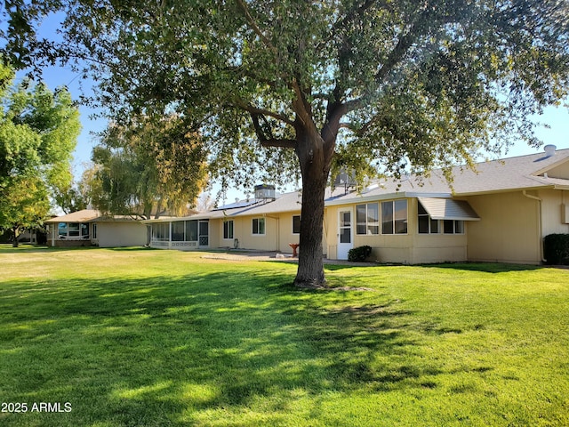 view of yard featuring a sunroom