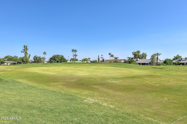 view of property's community with a lawn