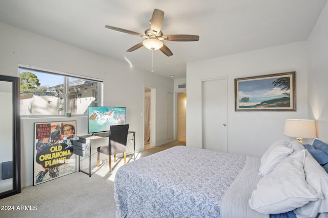 bedroom with light carpet and ceiling fan