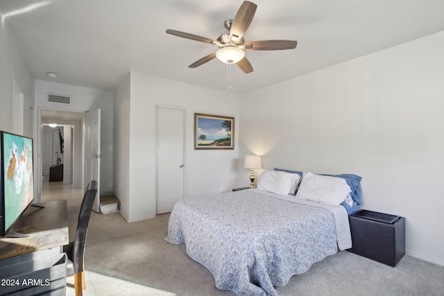 carpeted bedroom featuring ceiling fan