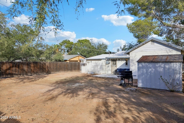 exterior space with a storage shed