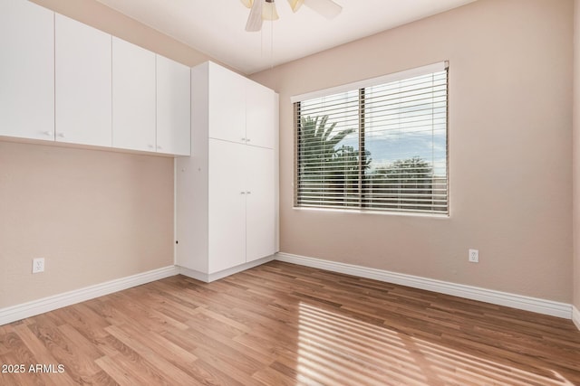 unfurnished bedroom featuring ceiling fan and light wood-type flooring