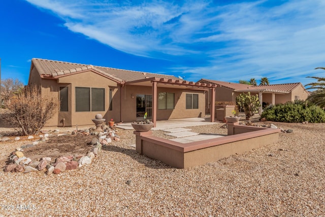 rear view of house featuring a patio area