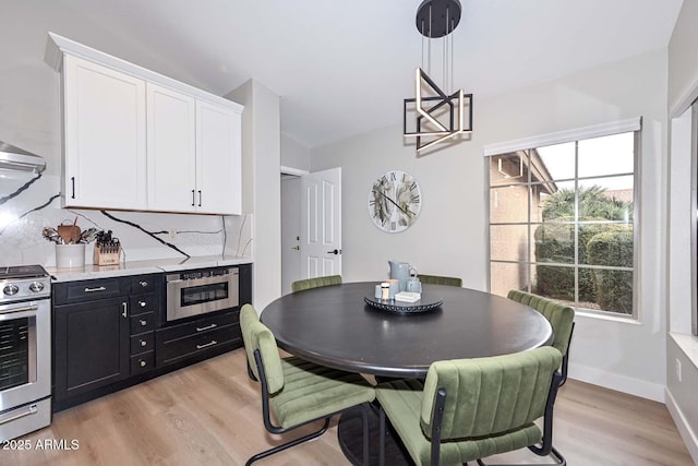 dining room with light hardwood / wood-style flooring