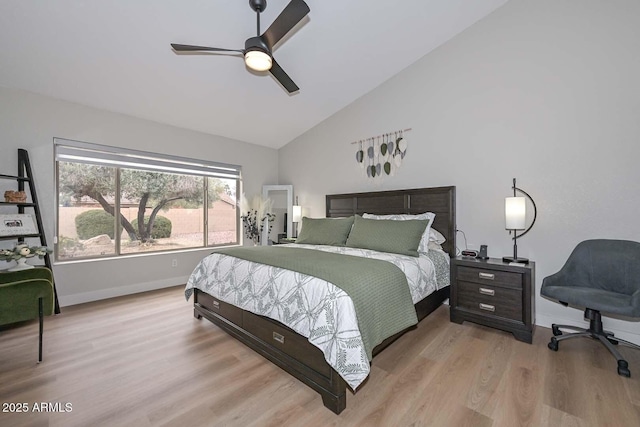 bedroom featuring ceiling fan, lofted ceiling, and light hardwood / wood-style floors