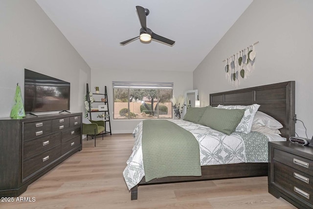 bedroom with lofted ceiling, ceiling fan, and light hardwood / wood-style flooring