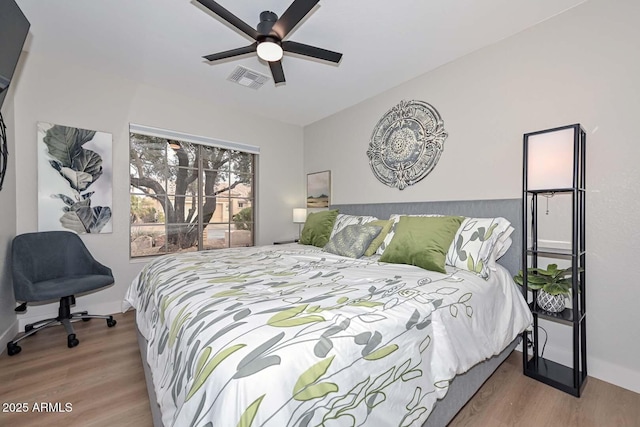 bedroom featuring hardwood / wood-style flooring and ceiling fan