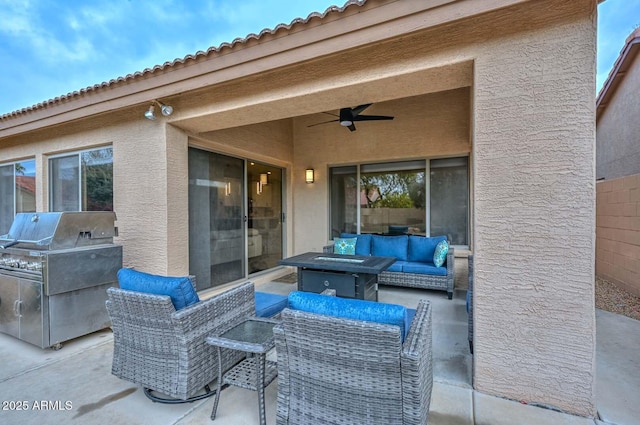 view of patio featuring ceiling fan, grilling area, and an outdoor hangout area