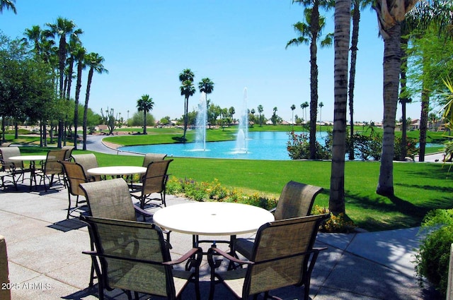 view of patio with a water view