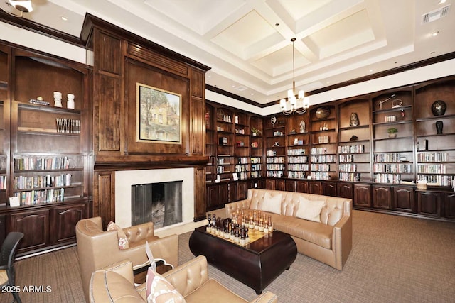 interior space featuring carpet flooring, coffered ceiling, a high end fireplace, an inviting chandelier, and built in shelves