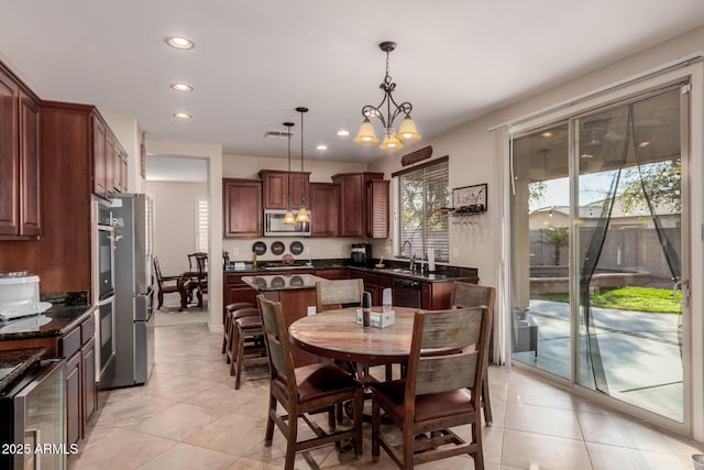 dining space with light tile patterned flooring, sink, a notable chandelier, and wine cooler