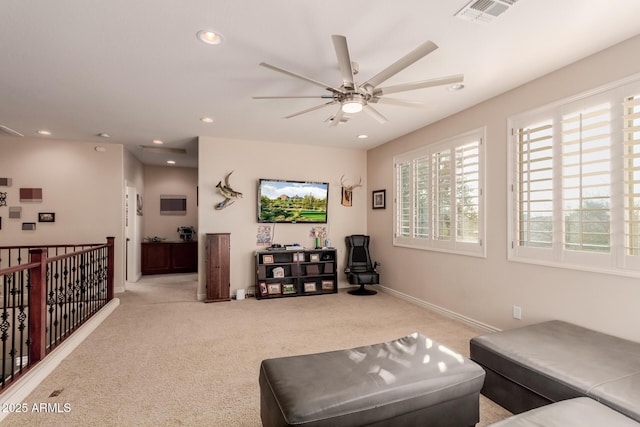 living room featuring ceiling fan and light carpet