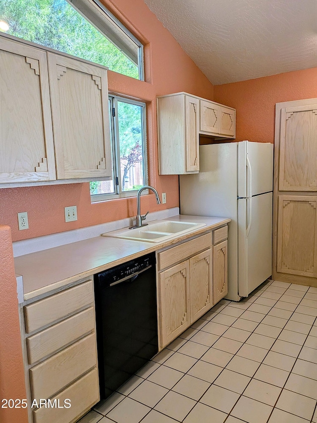 kitchen featuring black dishwasher, a sink, light countertops, vaulted ceiling, and a textured ceiling
