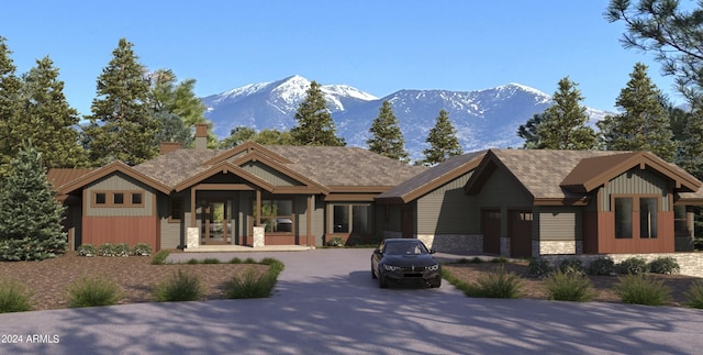 view of front of home featuring a porch, stone siding, and a mountain view