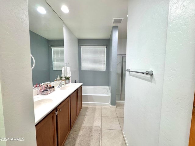 bathroom with vanity, shower with separate bathtub, and tile patterned flooring