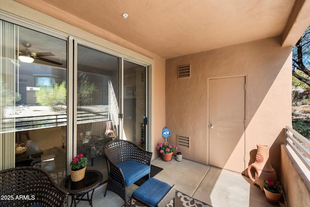 view of patio with visible vents and a balcony