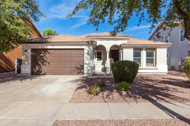 view of front of property with a garage