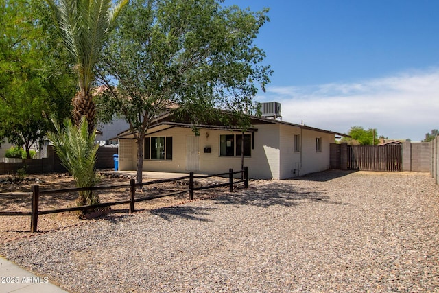 2936 E Beck Ln, Phoenix, AZ 85032 - view of front of property with fence, a patio, concrete block siding, a gate, and central air condition unit