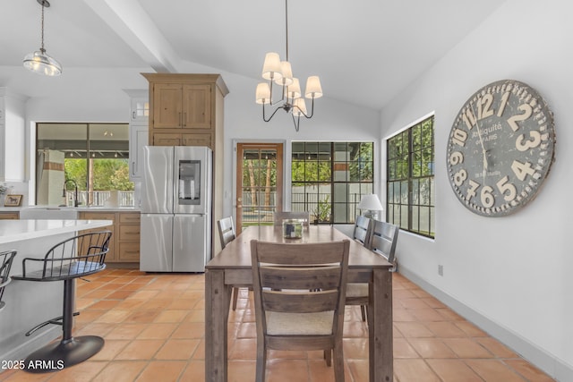 dining area featuring baseboards, vaulted ceiling, a chandelier, and light tile patterned floors