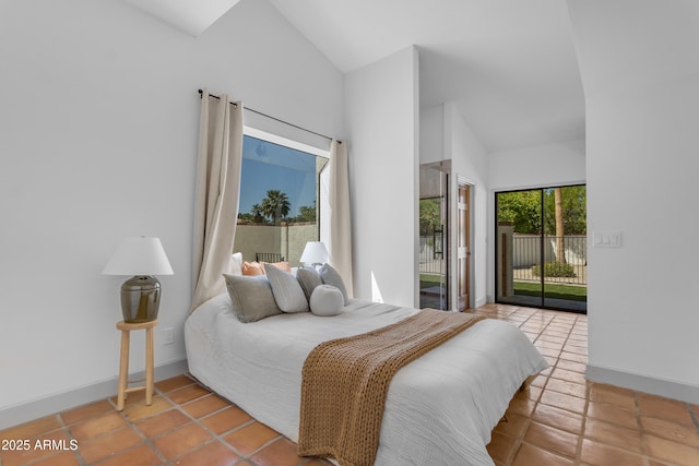 tiled bedroom featuring baseboards, high vaulted ceiling, and access to exterior