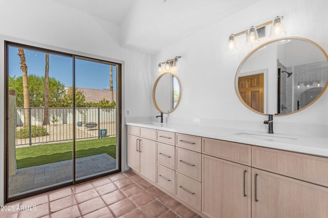 bathroom featuring a sink and double vanity