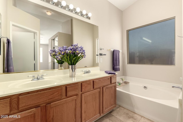 16288 W Hadley St, Goodyear, AZ 85338 - full bath featuring double vanity, a garden tub, and tile patterned floors