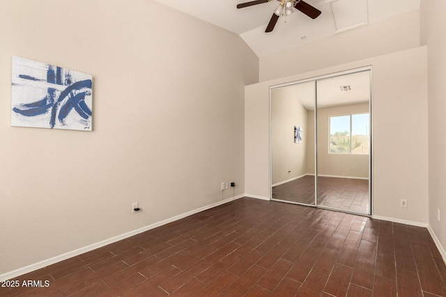 16288 W Hadley St, Goodyear, AZ 85338 - unfurnished bedroom with a closet, lofted ceiling, dark wood-type flooring, and ceiling fan