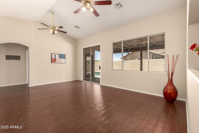 16288 W Hadley St, Goodyear, AZ 85338 - unfurnished room featuring ceiling fan, arched walkways, dark wood-style floors, and lofted ceiling