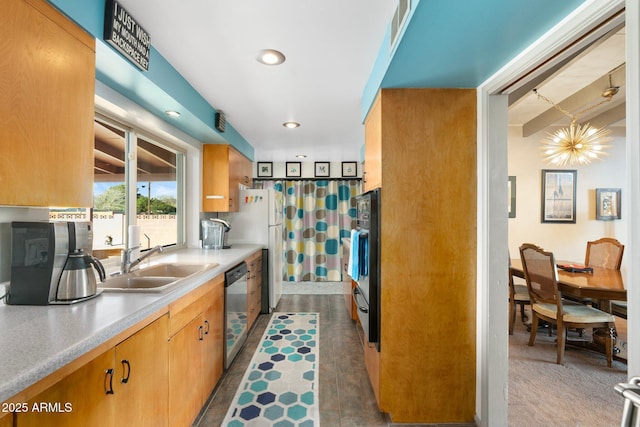 kitchen featuring visible vents, a sink, recessed lighting, light countertops, and dishwasher